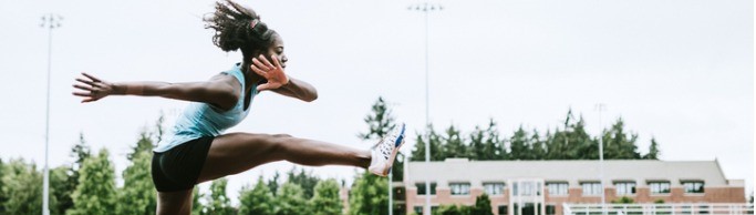 woman athlete runs hurdles for track and field picture id993744768 header image
