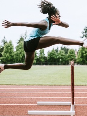 woman athlete runs hurdles for track and field picture id993744768 mobile image