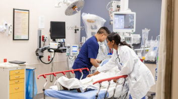 ER doctor and nurse prepare unconscious woman for examination