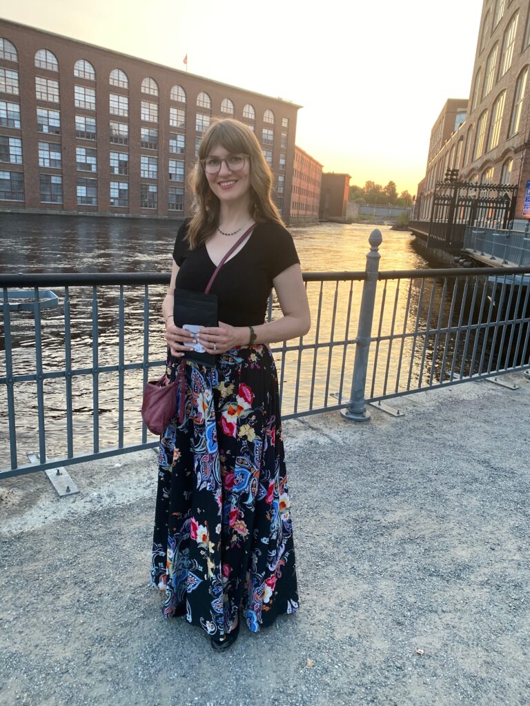Leslie Boyce standing near a city river