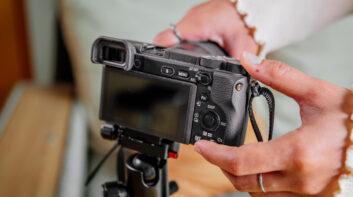 Woman setting up her filming camera