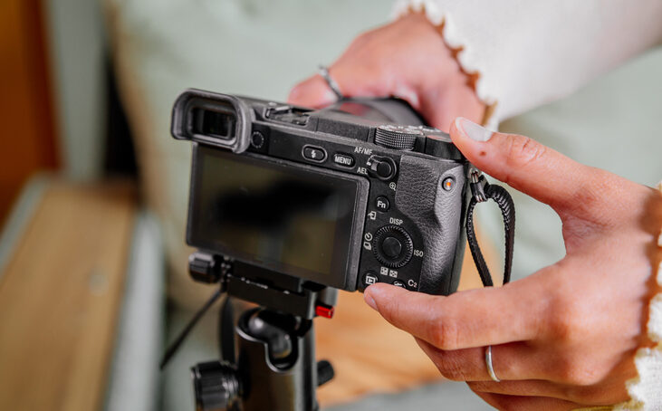 Woman setting up her filming camera