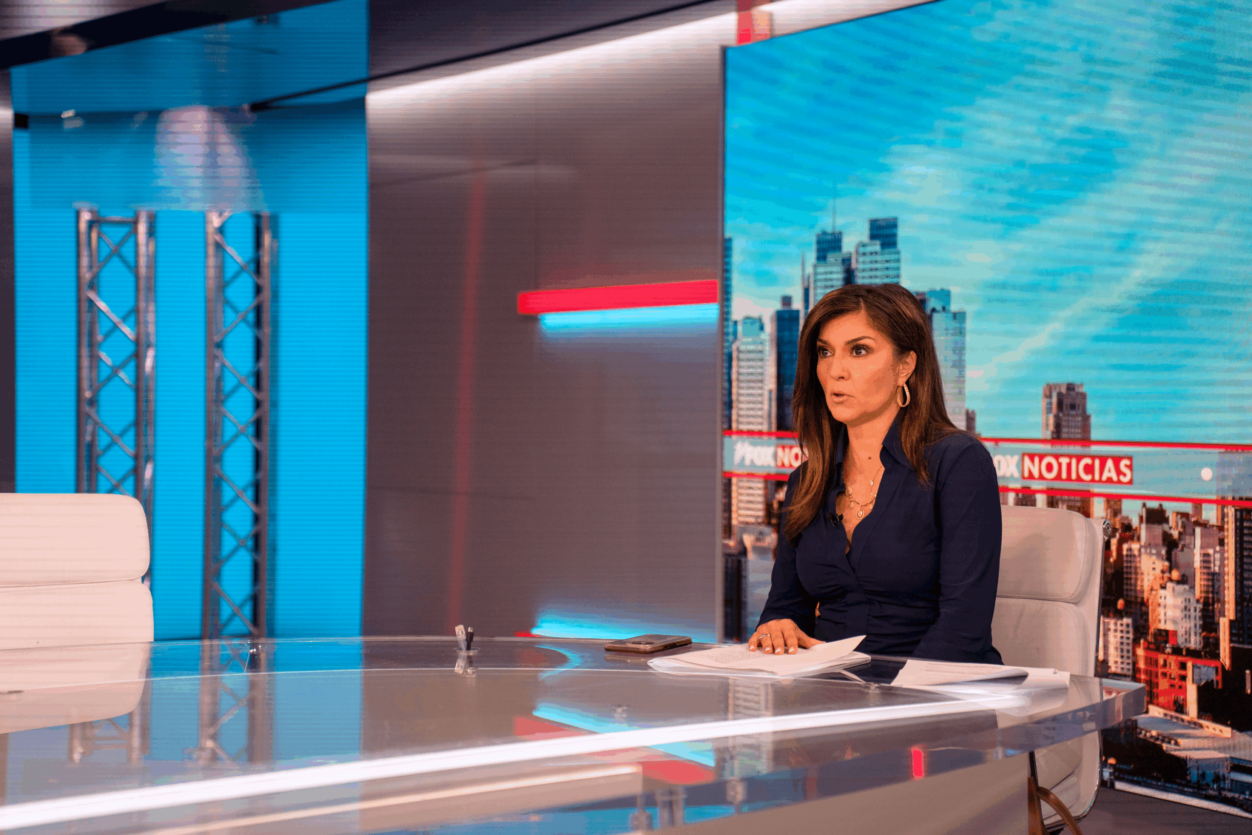 Rachel Campos-Duffy sitting at the Fox Noticias desk