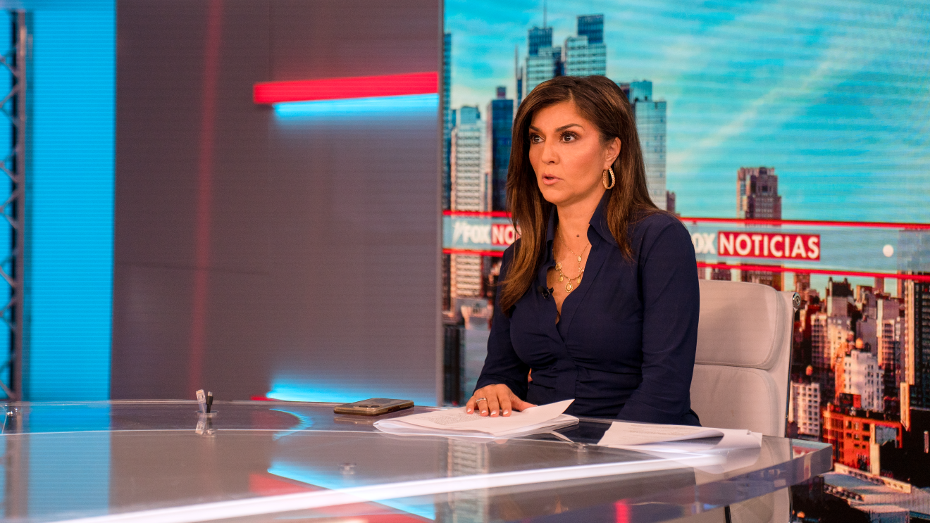 Rachel Campos-Duffy sits in the anchor seat during Fox Noticias