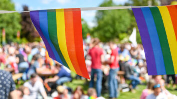 LGBT Pride Flags with people in the background