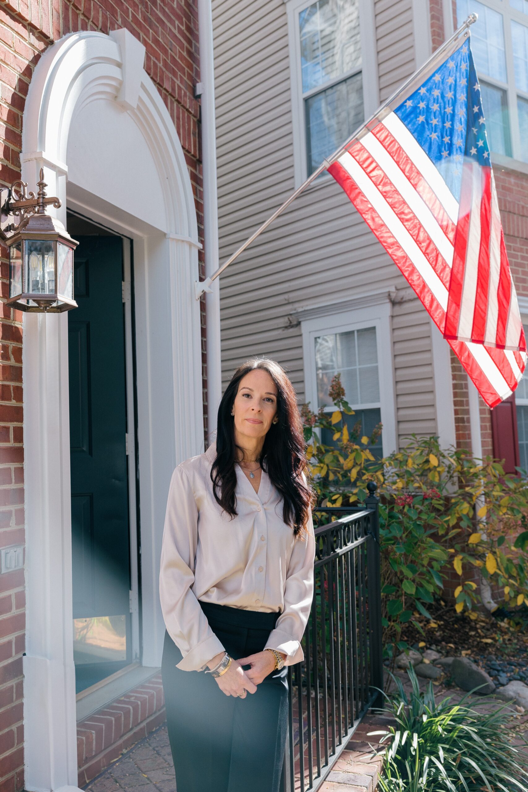 Krista Simpson Anderson stands outside of her Virginia home