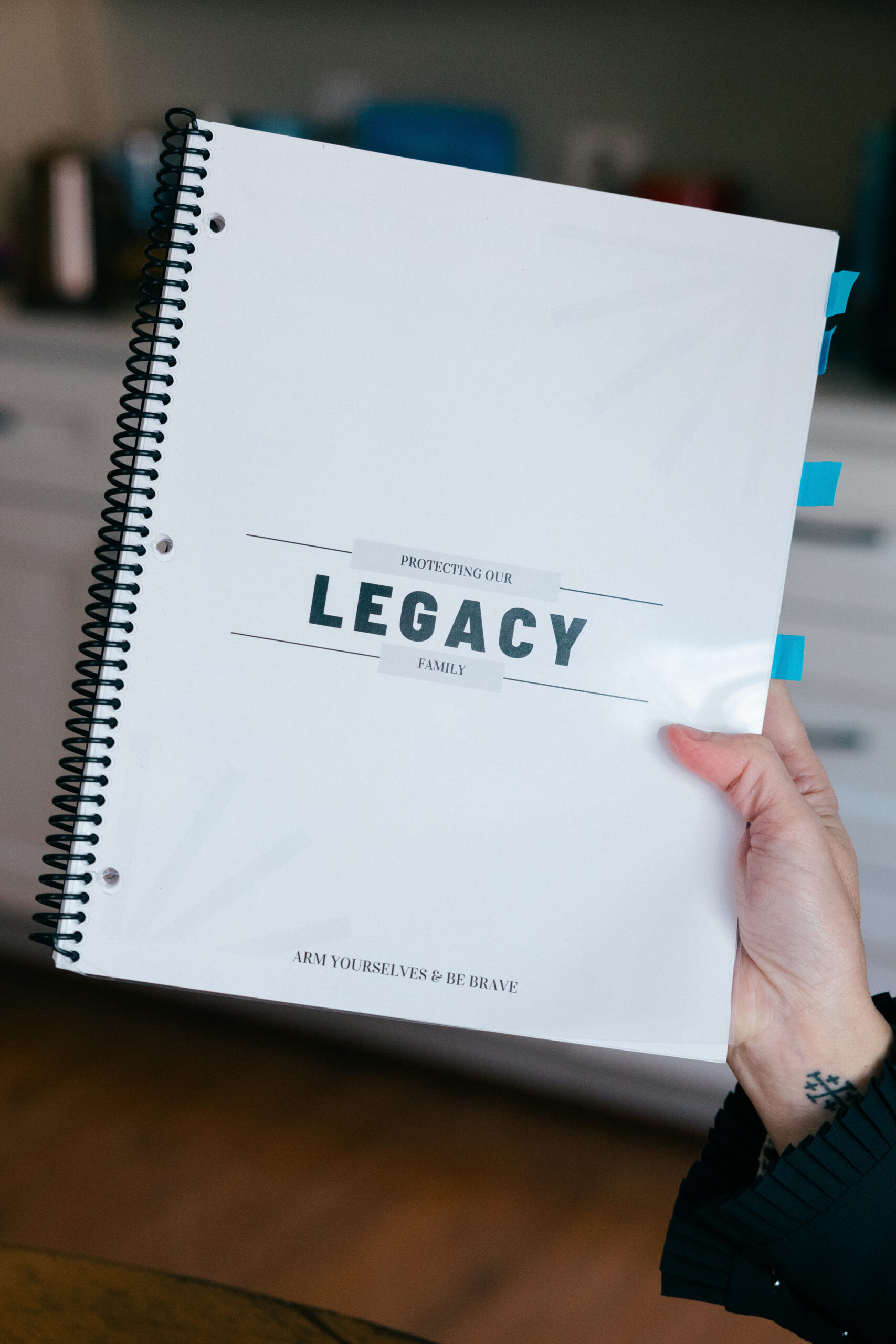 Anderson holds materials from the Unquiet Professional's program to protect one's legacy