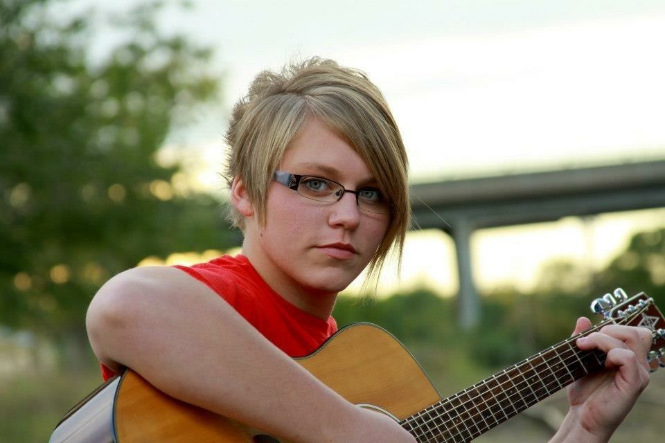 Brittany Thrasher playing guitar