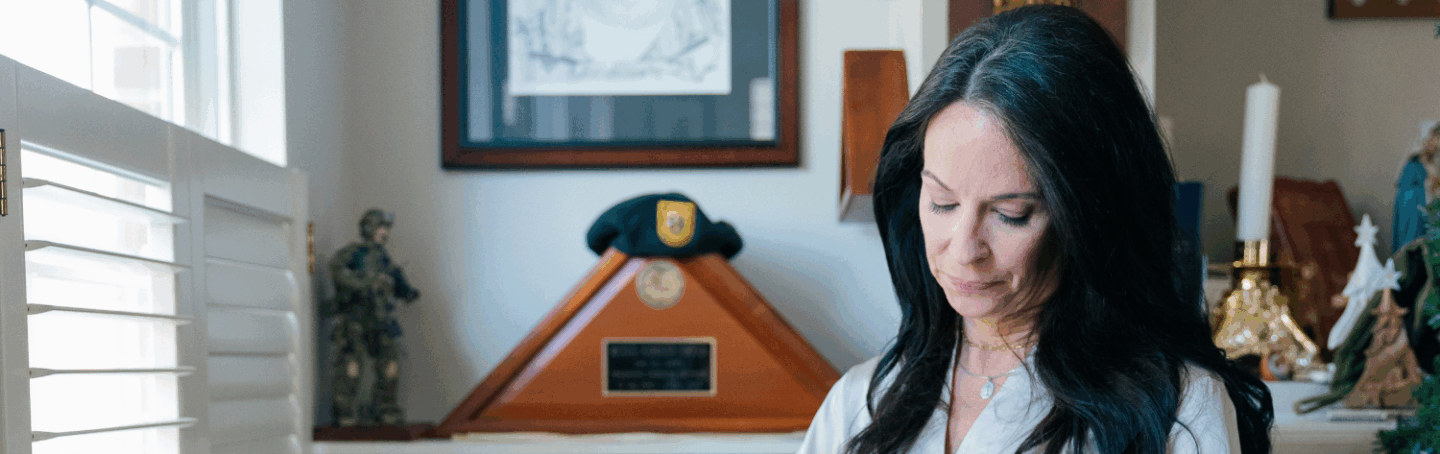 Krista Simpson Anderson holds her husband's service flag