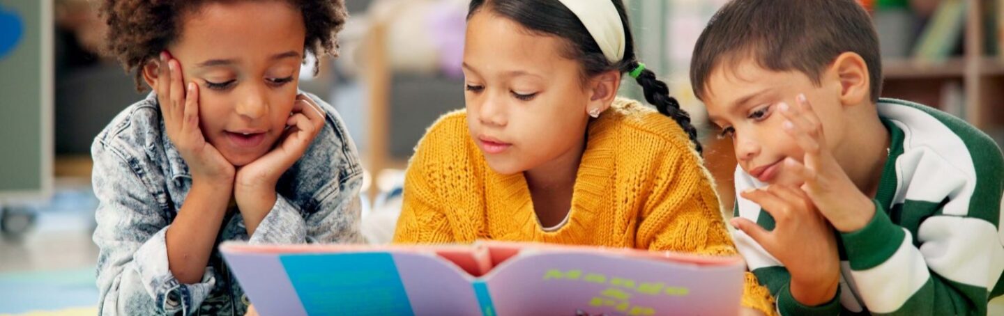Children reading together in a library
