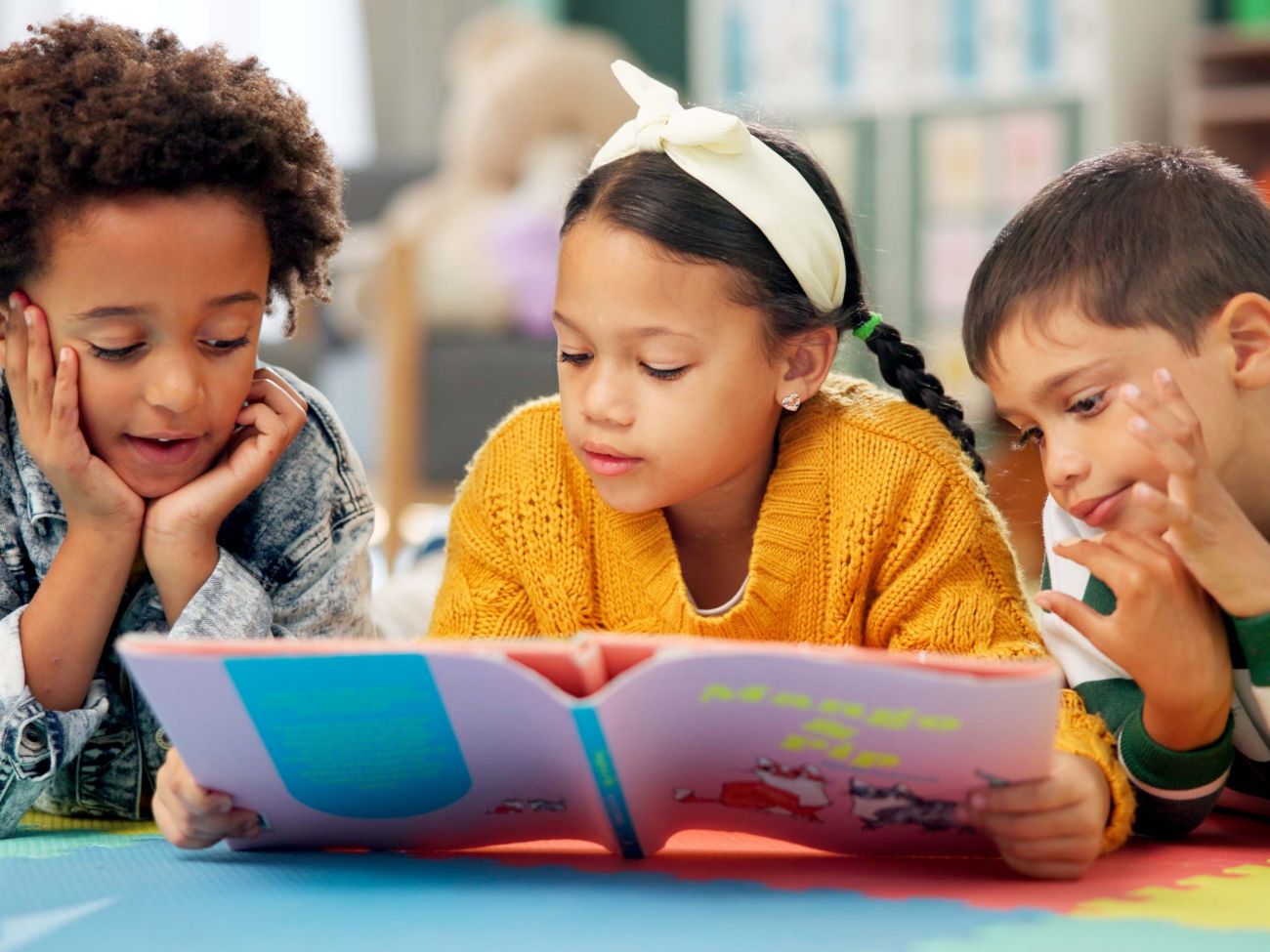 Children reading together in a library