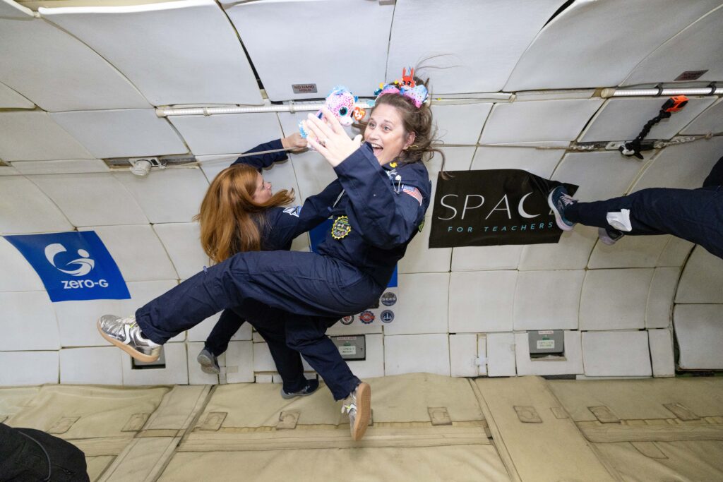 Megan Tucker aboard a microgravity flight conducting experiments