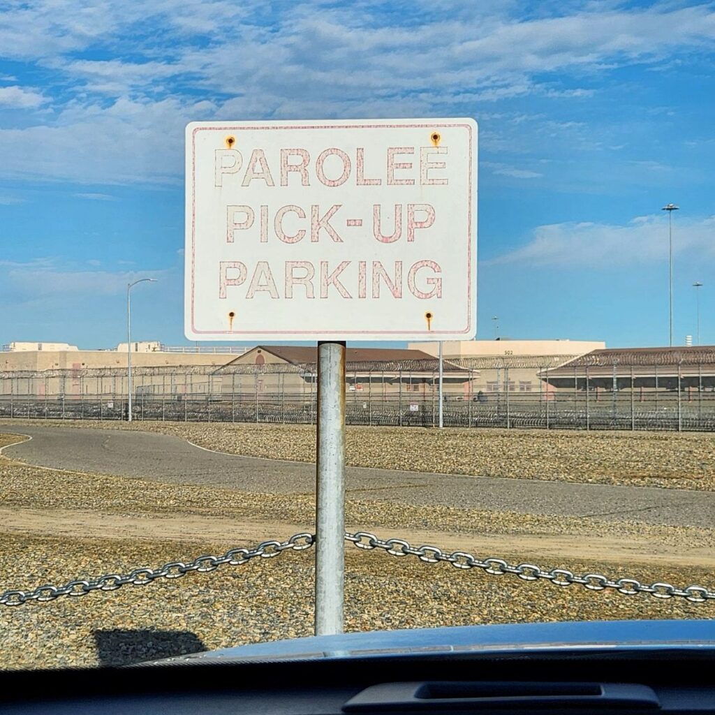 Parolee pick up parking sign