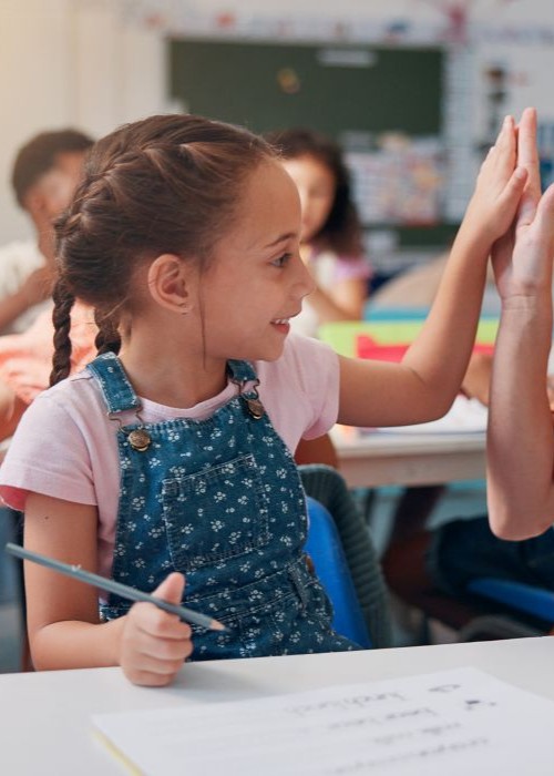 Student high fiving teacher mobile image