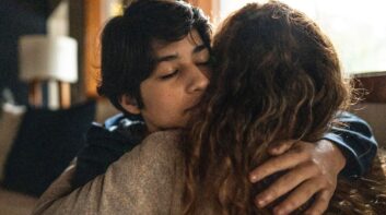 Mother hugging and protecting her teenage son