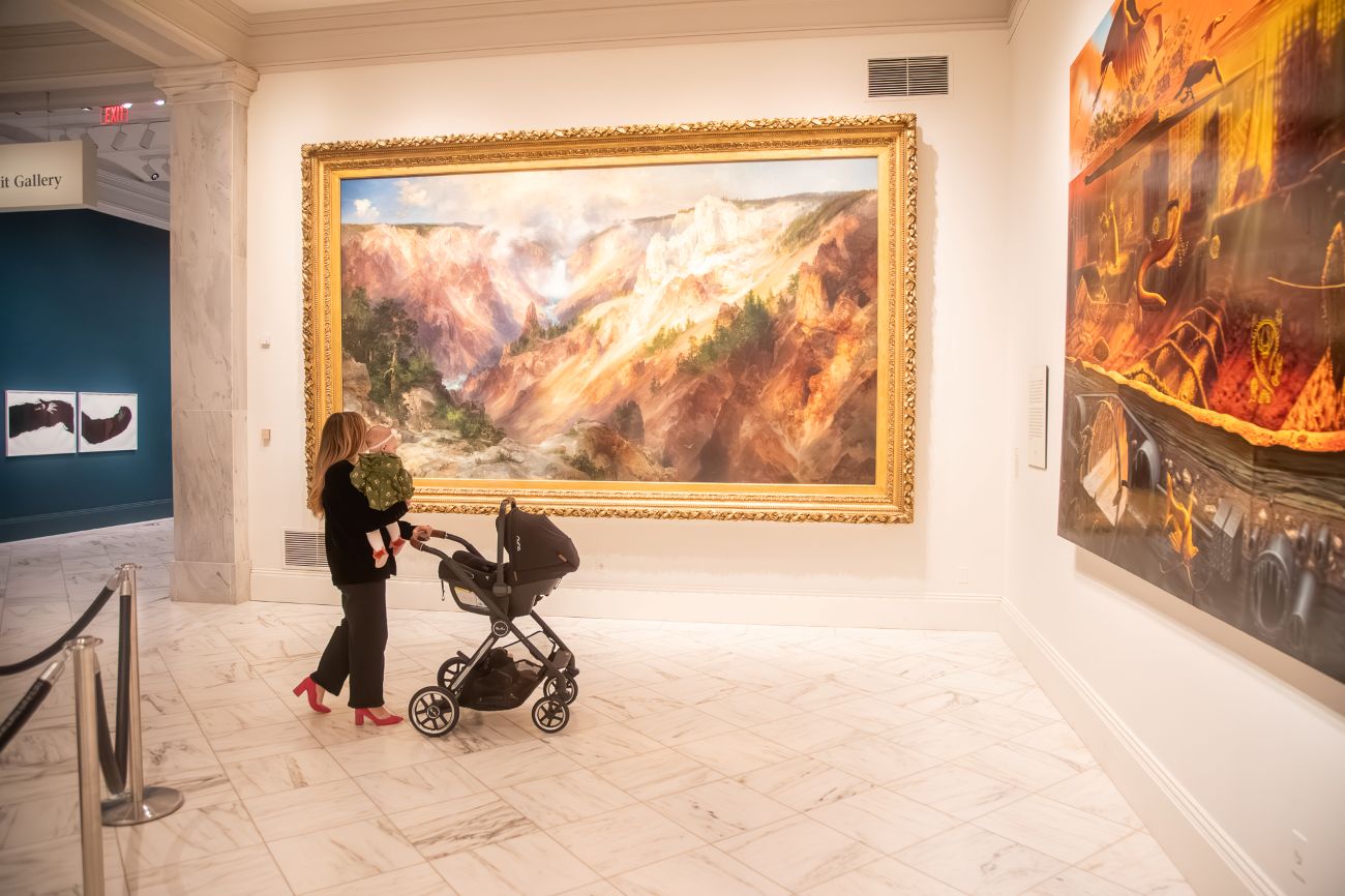 Isabel Brown walking with baby Isla and stroller