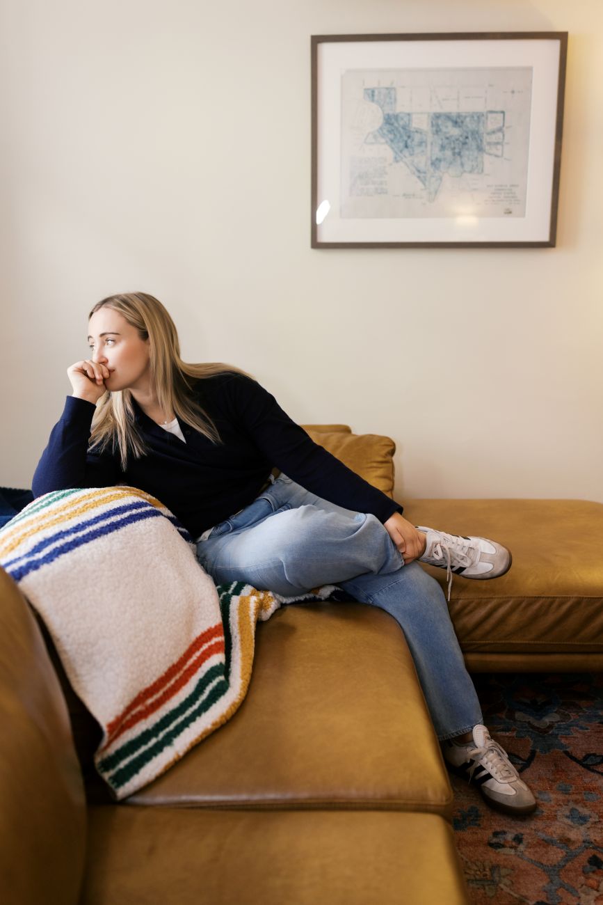 Emily Jashinsky sitting at home on the couch