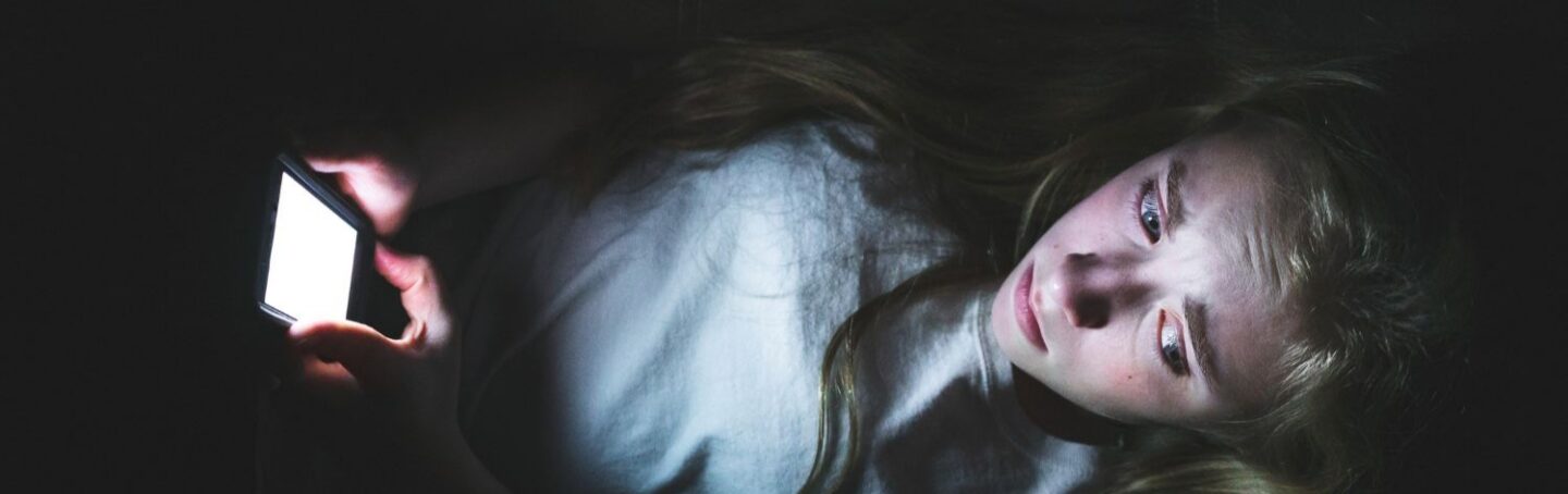 Young girl scrolling online header