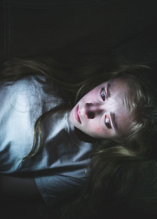 Young girl scrolling online mobile image