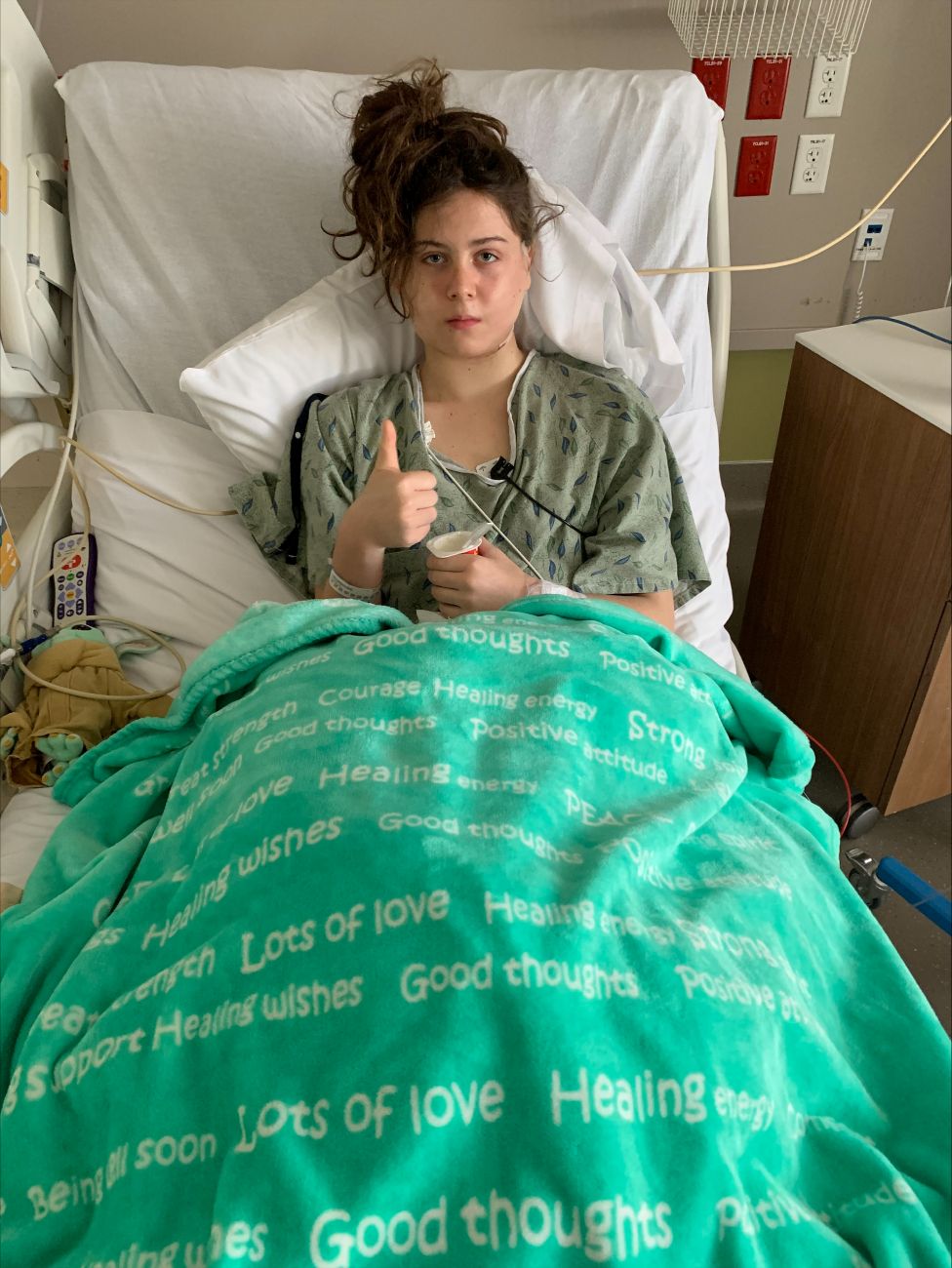 Brooke Garner in the hospital after thyroid cancer surgery