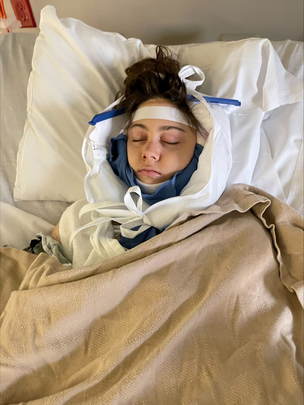 Brooke Garner in the hospital after thyroid cancer surgery
