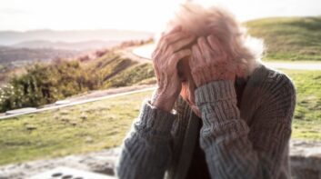 Elderly woman sitting alone in rural America