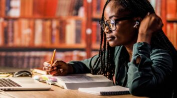 Student reading a textbook