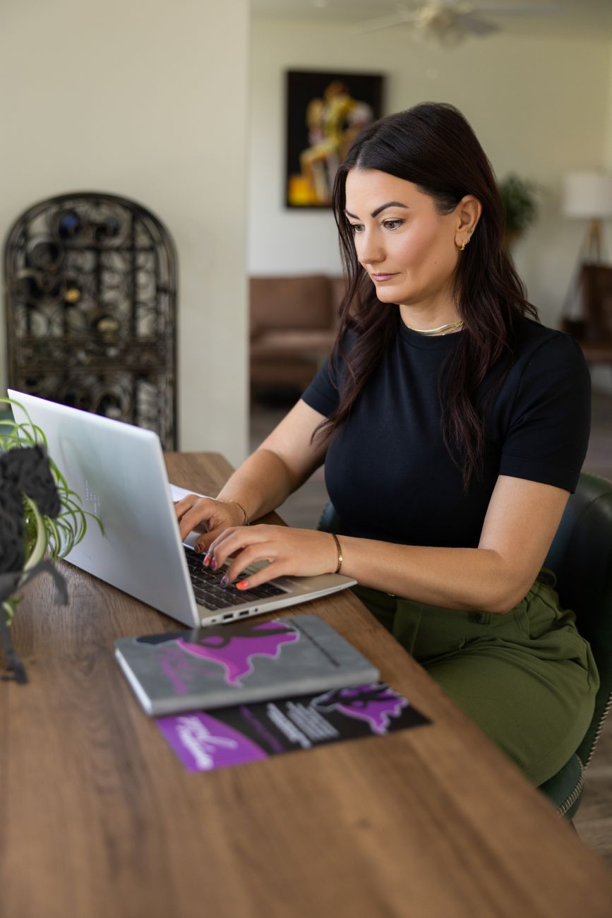Dallas Knight working at her laptop