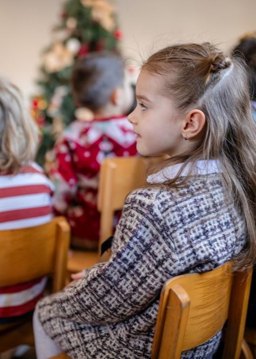 Elementary school students celebrating Christmas