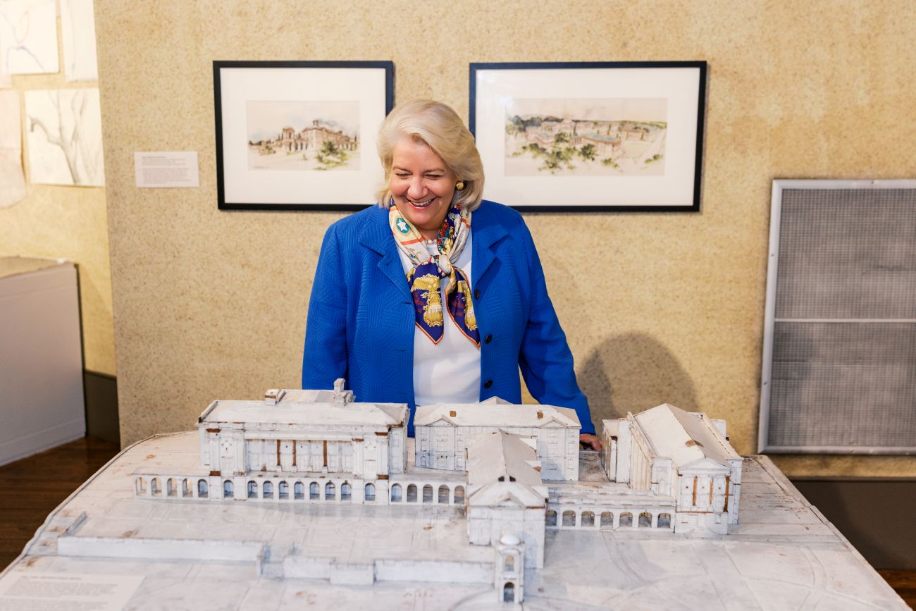 Mary Pope Hutson and a model of Sweet Briar's historic buildings