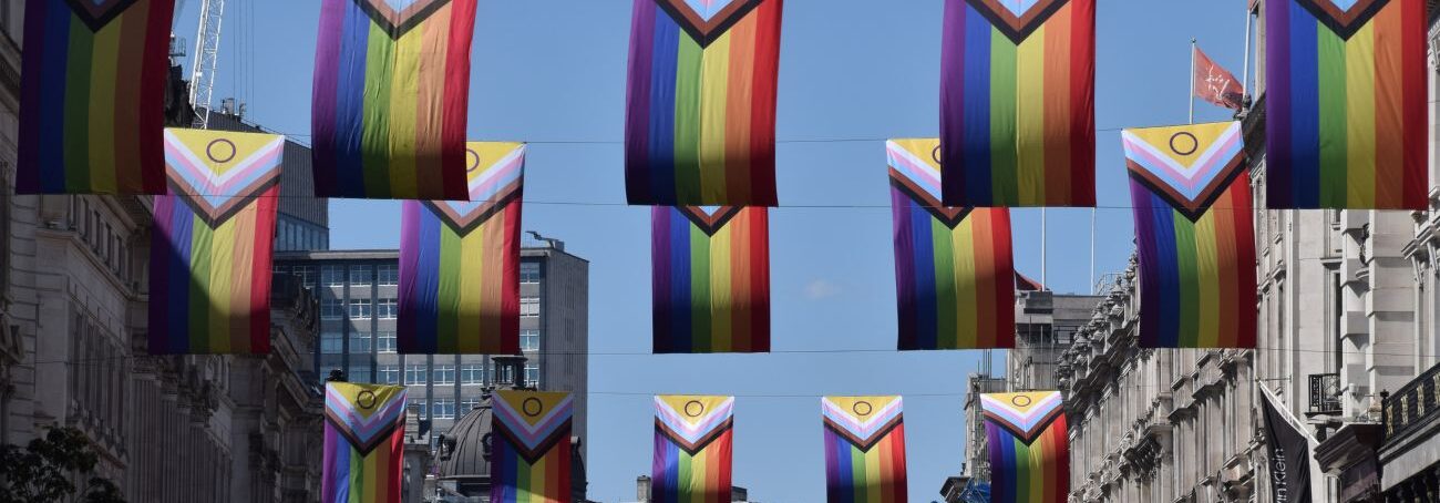 Pride flags overhead a street